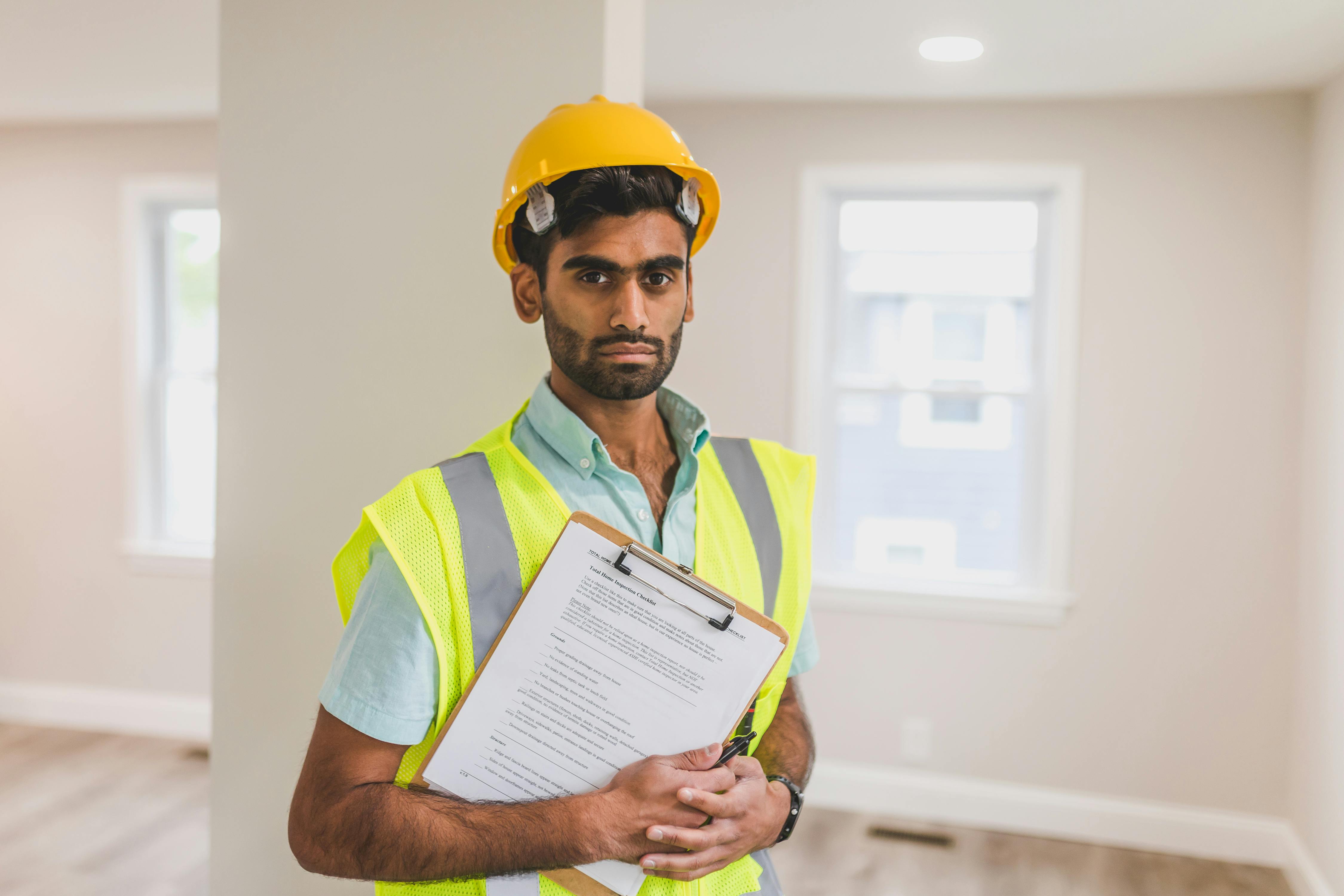 Technician with clipboard in a home